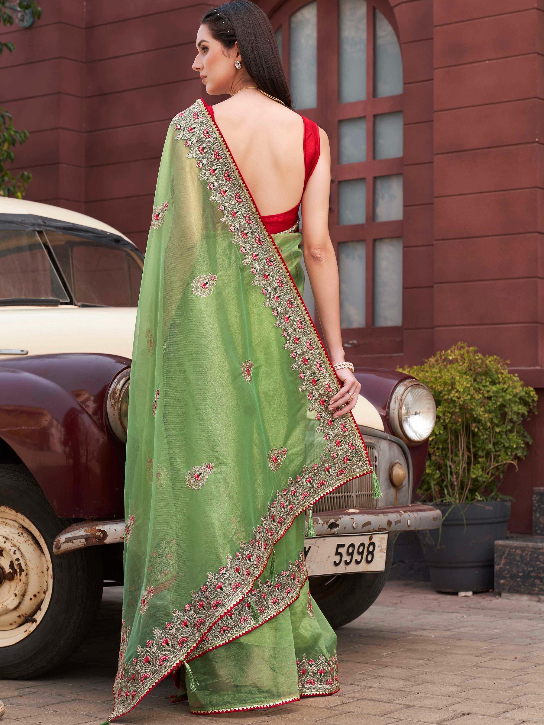 Green colored shimmer net embroidered saree